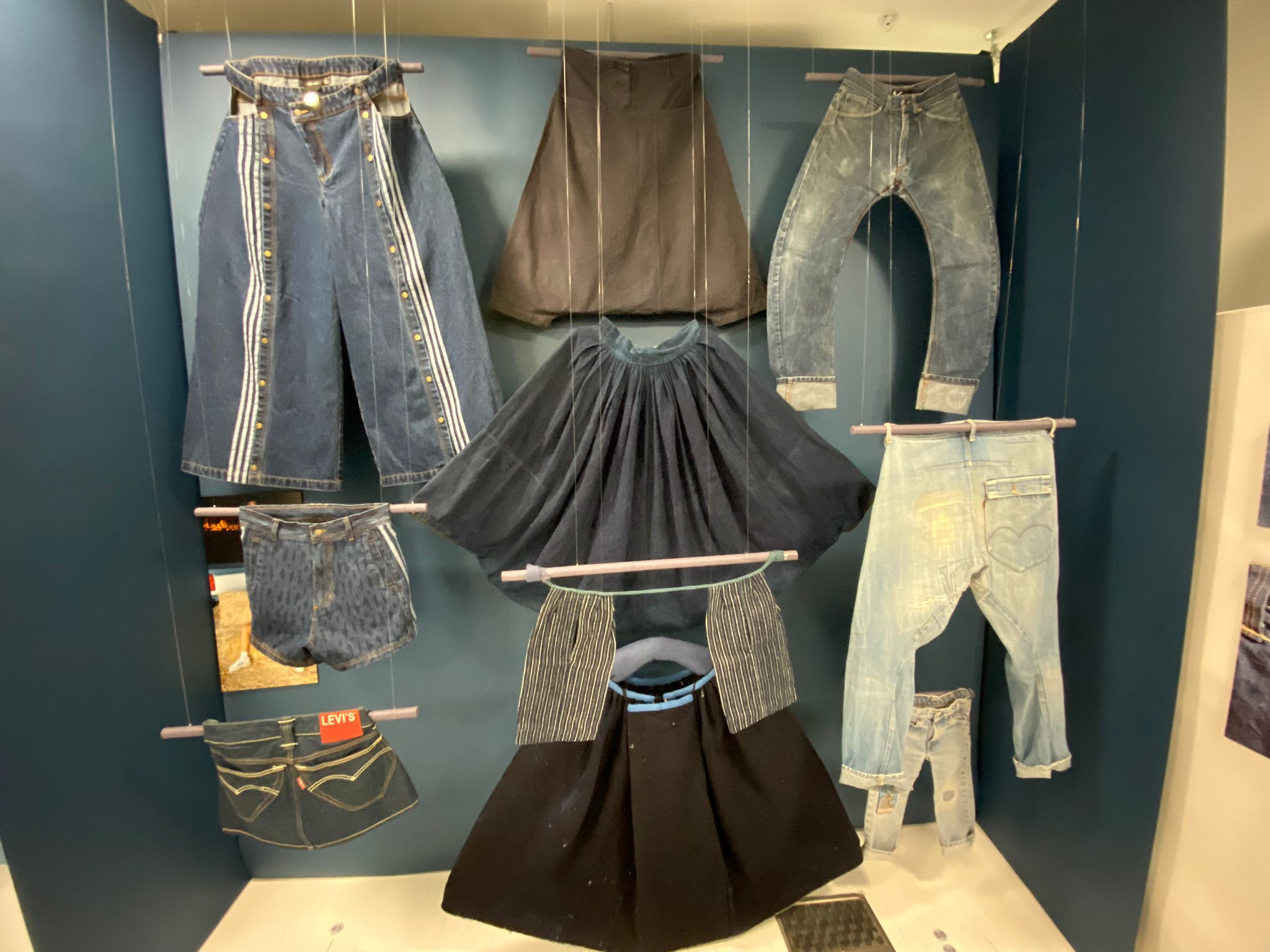 A display of blue garments including Denim